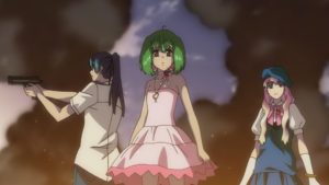 Ranka flanked by Alto and Sheryl with smoke and fire rising around them